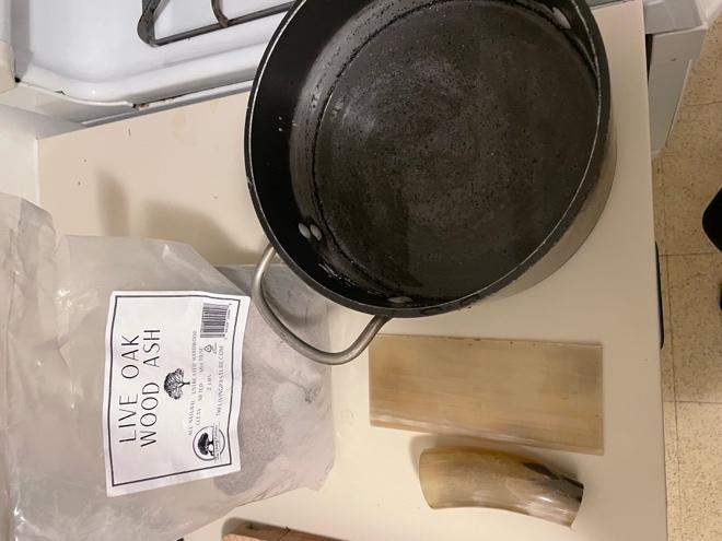 A pot and a bag of ash