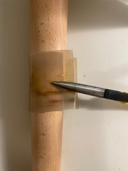 Curved horn sheet over wood