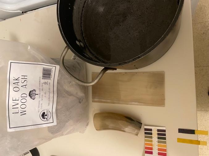 A pot and a bag of material