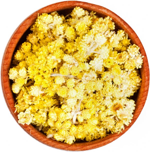 Dried yellow flowers and plant matter in bowl